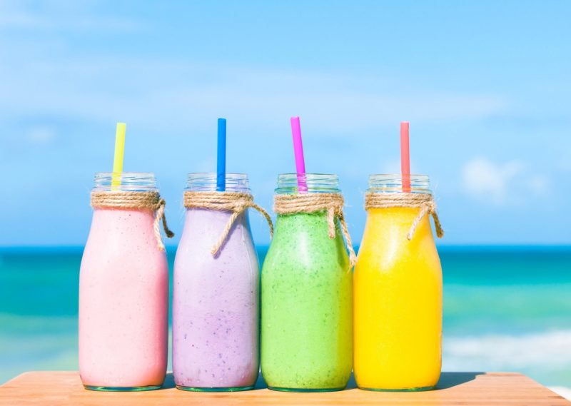 colorful smoothies on the beach