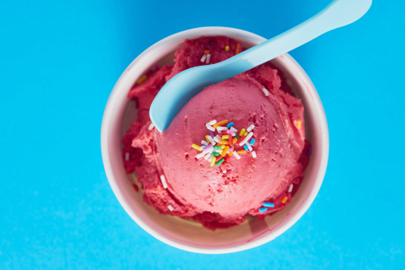ice cream and sprinkles with a spoon