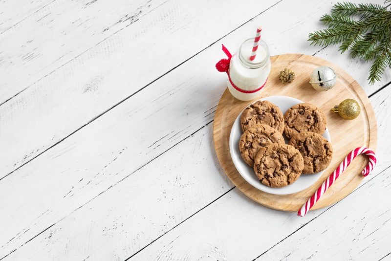 a plate of cookies with milk and candy cane. holiday cookie recipes
