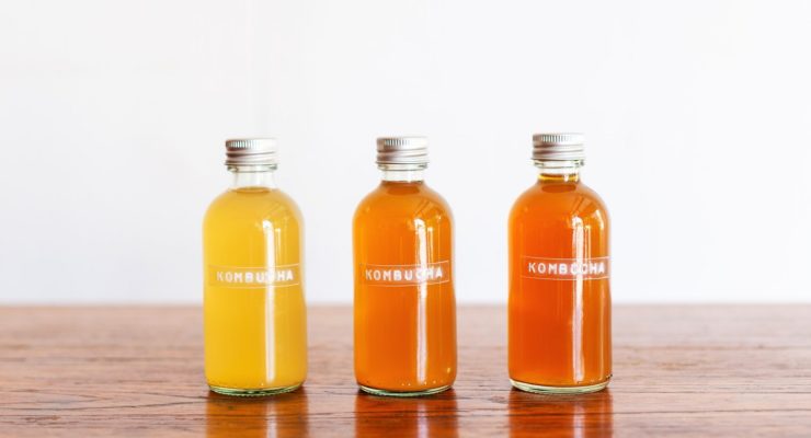 three bottles of different flavored kombucha