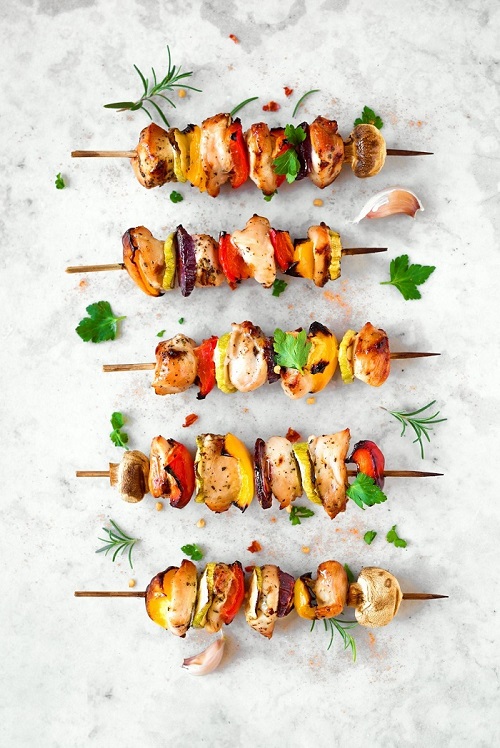 Grilled summer vegetable and chicken skewers