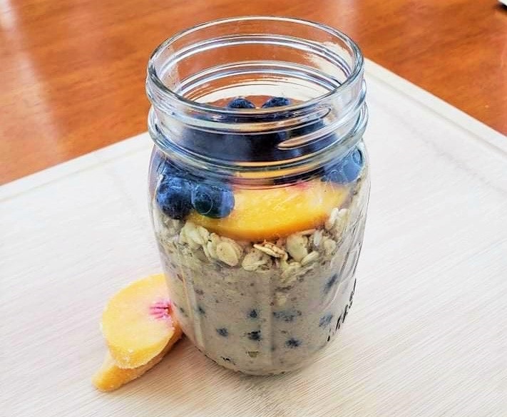Blueberry peach overnight protein oats in a jar