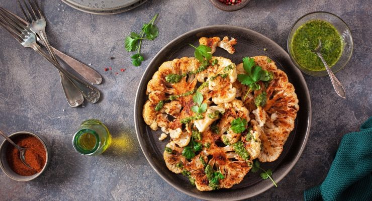 grilled cauliflower steaks with herb sauce and spices