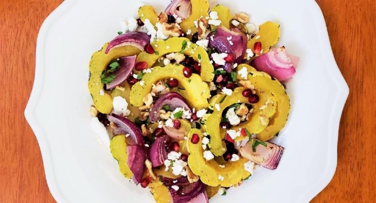 Roasted Delicata Squash Fall Salad with walnuts, pomegranate seeds, feta cheese and herbs
